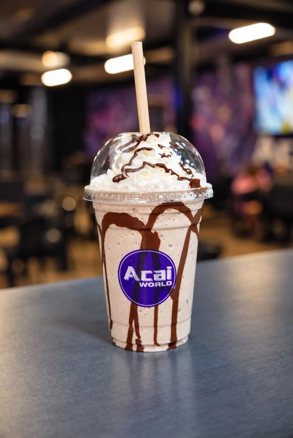 Açaí World milkshake with whipped cream and chocolate drizzle